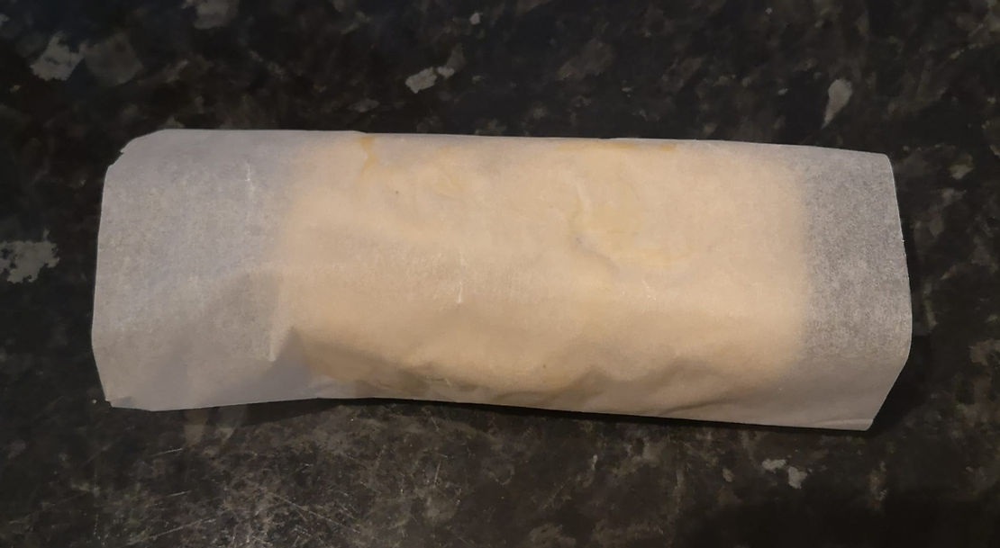 our block of cashew cheese wrapped up in greaseproof paper