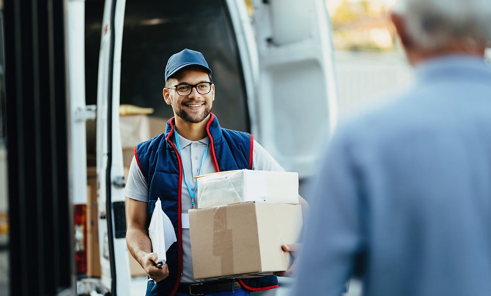 happy-deliverer-carrying-packages-while-making-home-delivery-his-customer.jpg