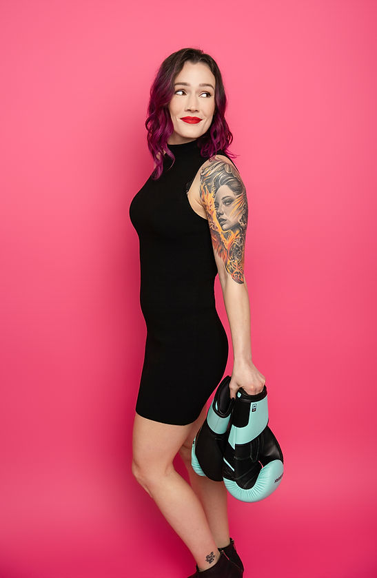 Photo of Amanda Goodfellow owner of Digital Unicorn holding her boxing gloves