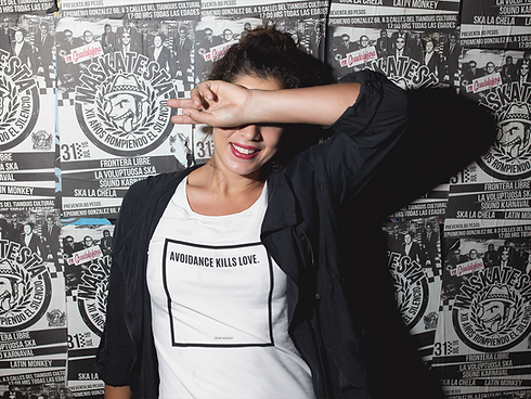 tee-mockup-of-a-young-woman-against-a-poster-wall-at-night-a11809.png