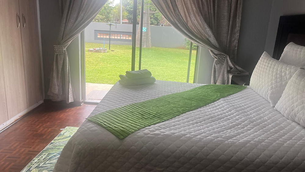 Exclusive accommodation bedroom with garden view