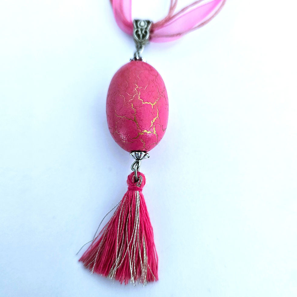 Pink bead and tassel pendant necklace with gold flecks and pink voile cord