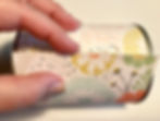 Closing the designer paper onto itself on the can / Gift-in-a-Can: Covering It (Part 2) / www.HoneycombOasis.com