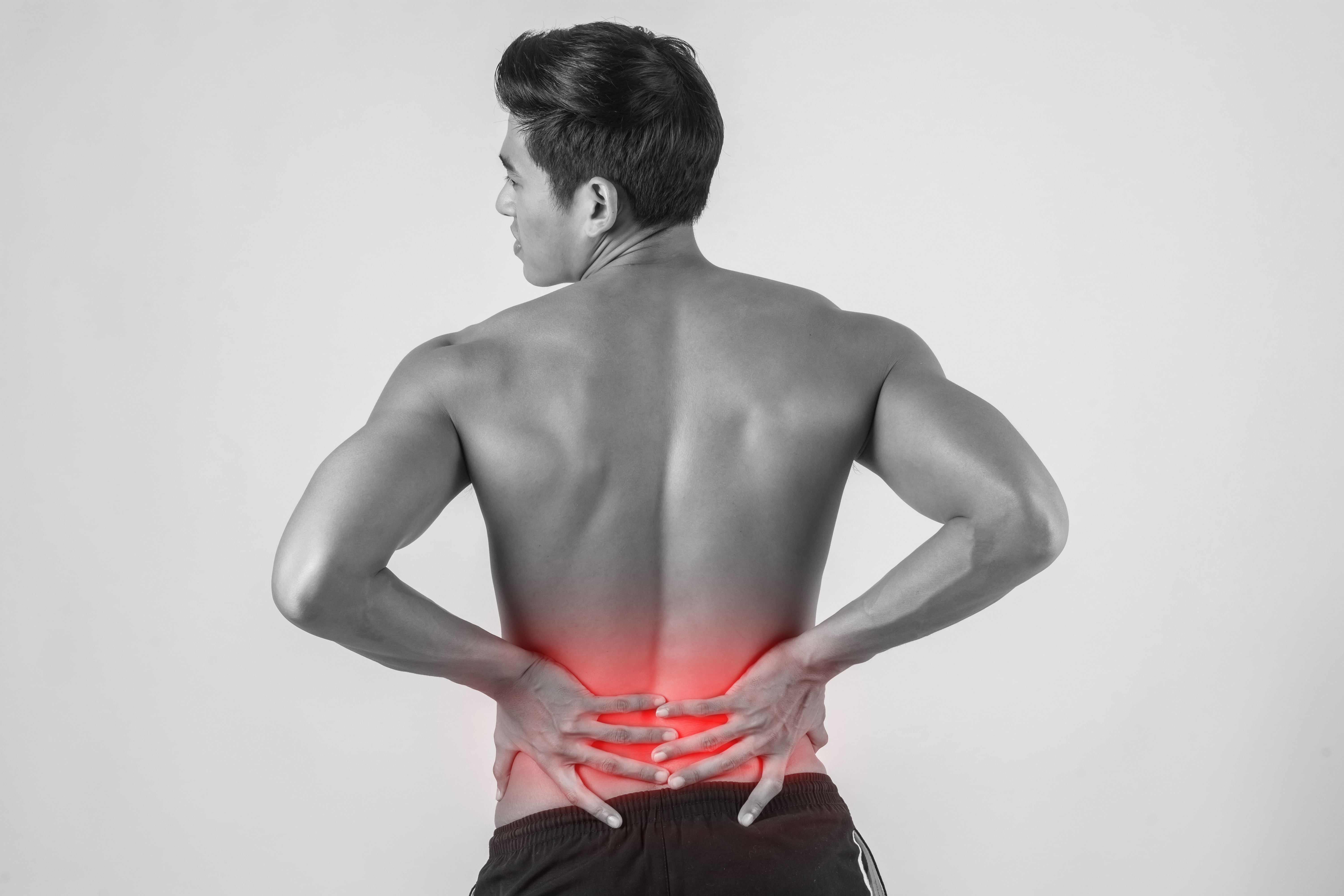 close-up-man-rubbing-his-painful-back-isolated-white-background (1).jpg