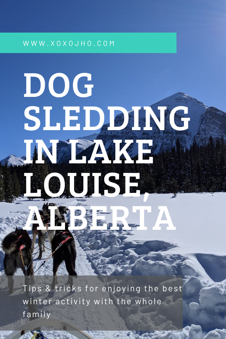 Photograph of girl travel blogger in Canada Rocky Mountains Lake Louise dog sledding