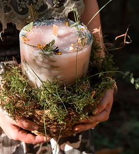 woman-holding-in-hands-craft-homemade-candle-outdo-2023-11-27-05-37-12-utc.jpg
