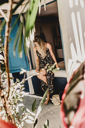 woman wearing floral dress sitting on window_edited.jpg