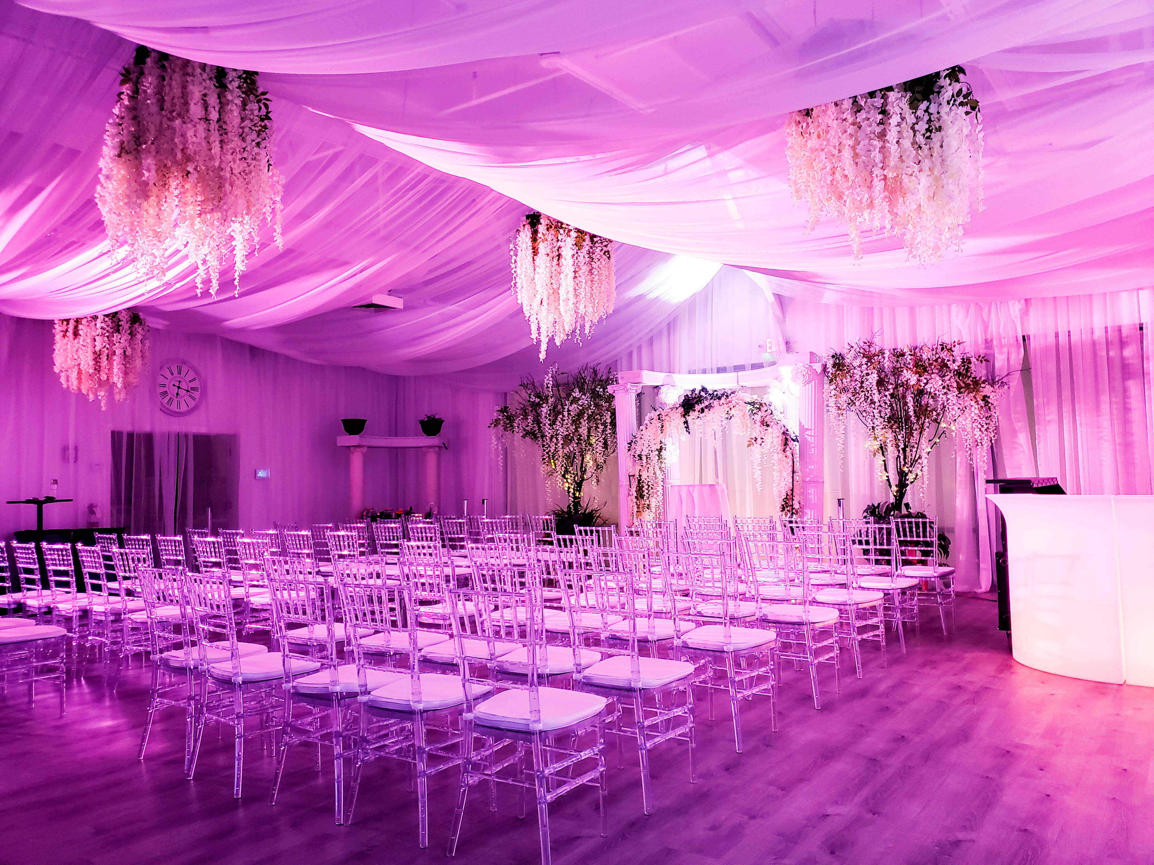 Wedding ceremony with pink lighting at Decades LV