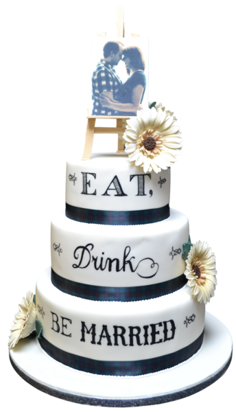 Three-tiered wedding cake with sugar paste, black ribbon, sugar flowers, and photo topper.