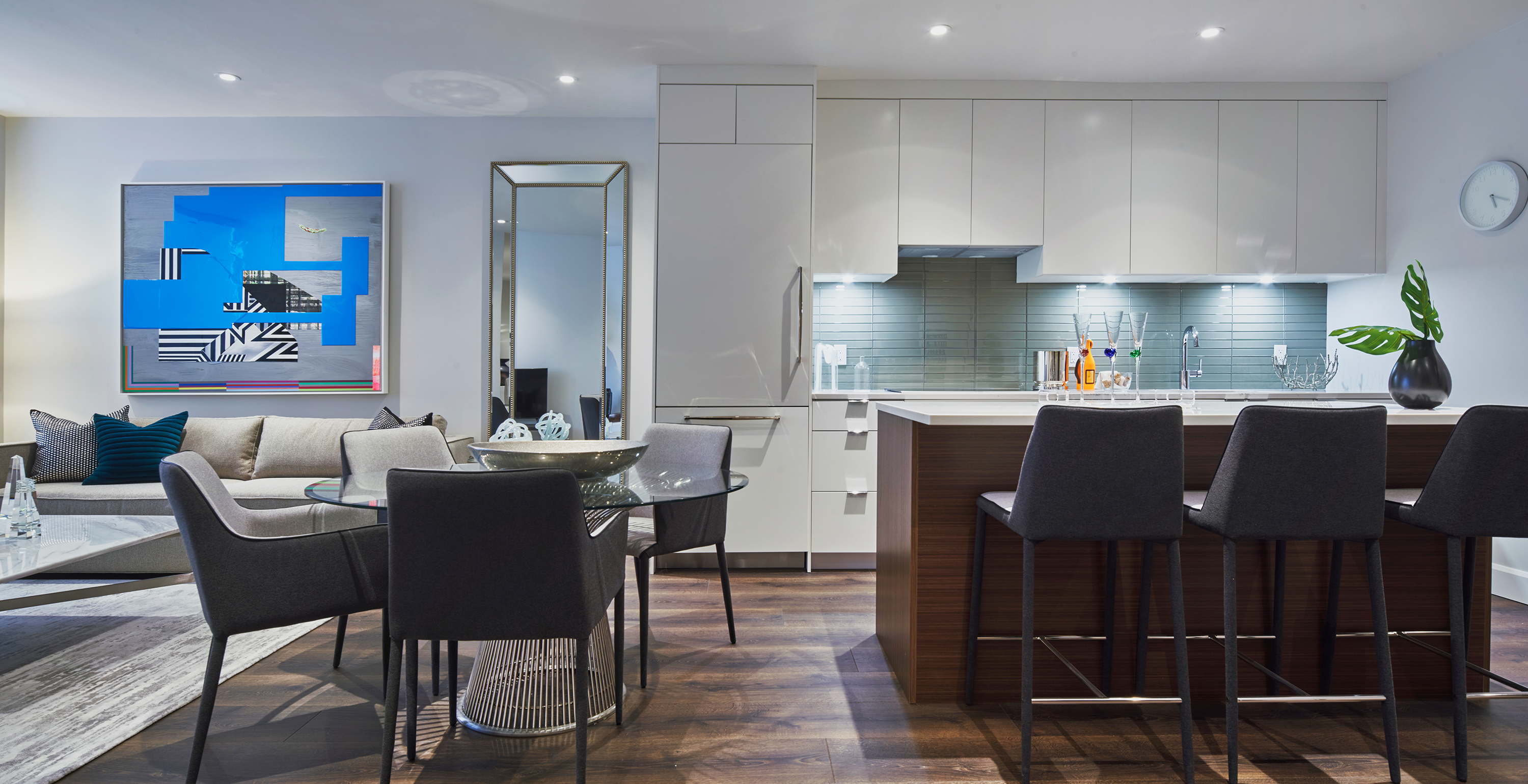 Modern condo-style kitchen with island and quartz countertops Montreal