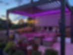 Modern aluminum pergola in Toronto with purple LED lighting.