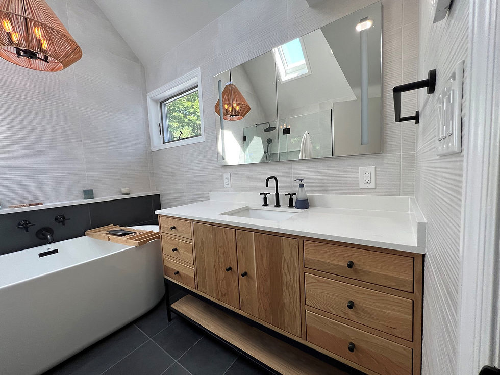 Double bathroom vanity with tiled backsplash and freestanding bathtum