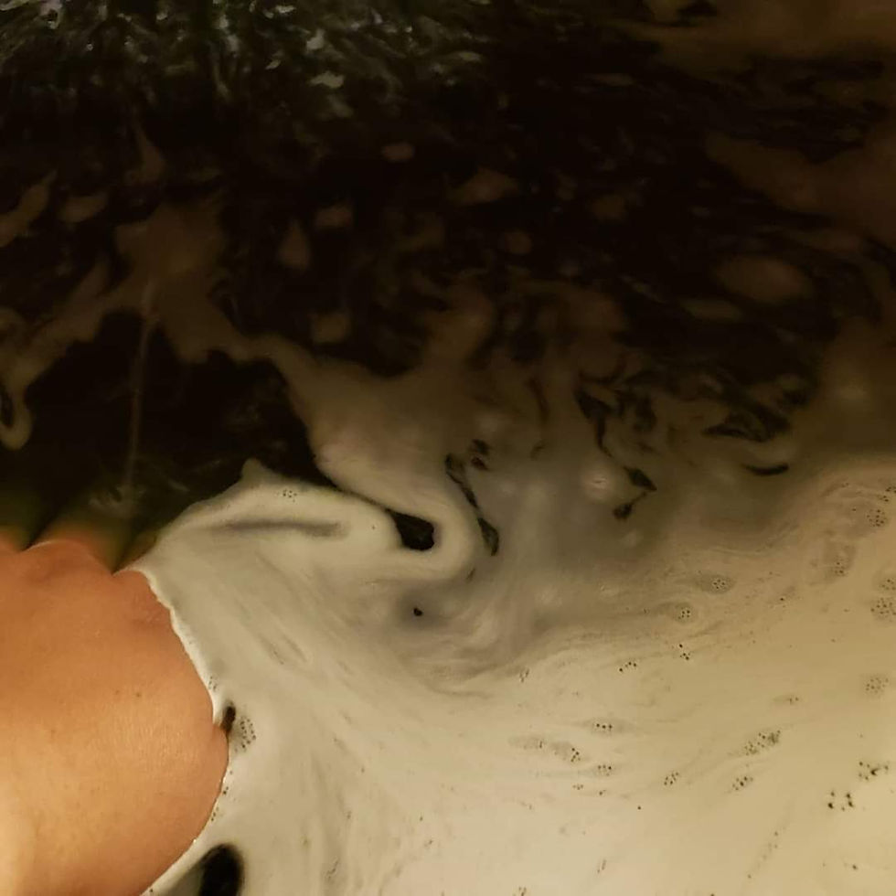 Thumbnail: Bath bomb action shot showcasing black water color.