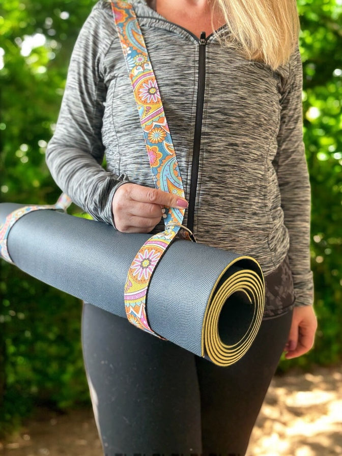 yoga mat strap being worn by a lady