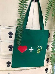 love and light emerald green tote bag