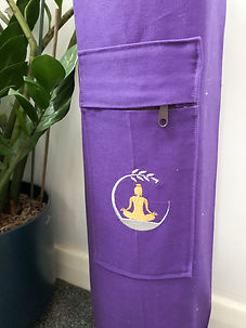 closeup of embroidered moon and lotus pose on yoga mat bag