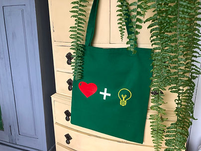 love and light emerald green tote bag