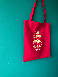eat sleep yoga repeat ruby red yoga tote bag