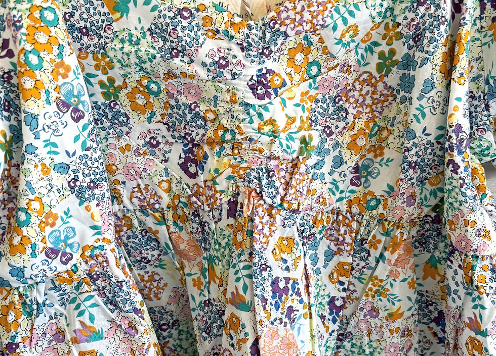 Thumbnail: Colorful cotton baby doll top with flowers.