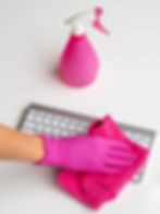 high-angle-hand-with-surgical-glove-cleaning-keyboard-with-cloth.jpg