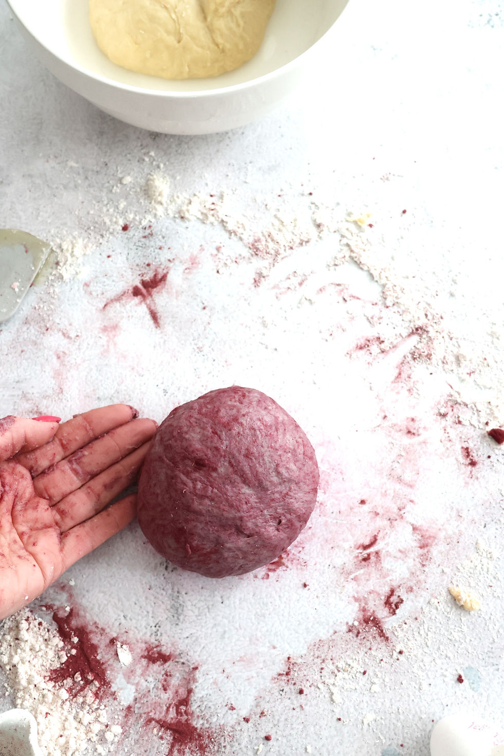 One portion of dough deep purple dyed with hibiscus powder.