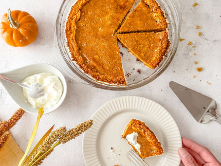 Slices of pumpkin pie set on a fall tablescape.