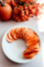 Thinly slices sweet potatoes placed in a baking dish