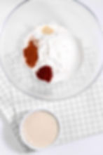 Dry ingredients (flour, paprika, salt, garlic powder) in a large clear mixing bowl.