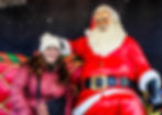 travel agent, Emma Guse, with a Santa statue