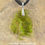 Thumbnail: Faux Green Amber Resting Dragon Necklace - In Stock and Ready to Ship