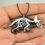 Thumbnail: Painted Resin Triceratops Skeleton Necklace