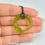 Thumbnail: Faux Green Amber Wyrm Ouroboros Necklace - In Stock and Ready to Ship