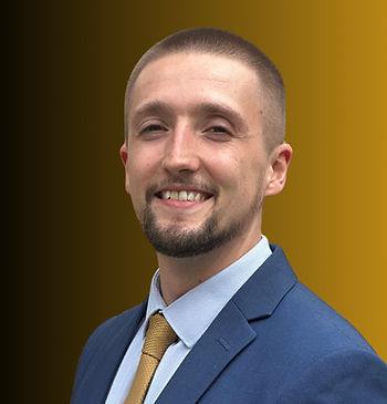 Image of Josh Furby, in a blue suit