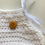 Thumbnail: White Knitted booties with wooden buttons