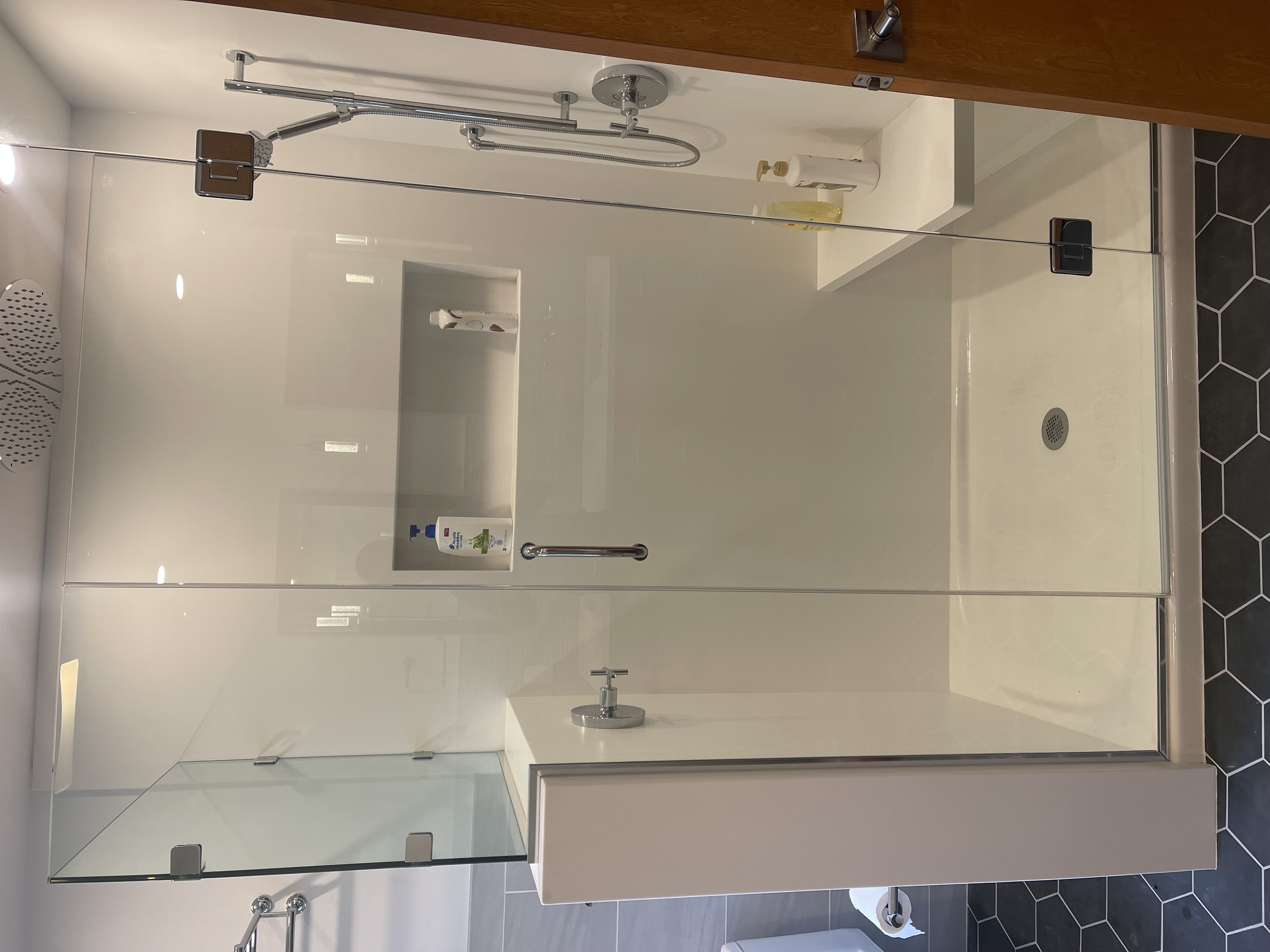 Glass shower enclosure installed in a bathroom remodel