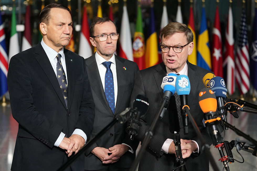 From right, Germany's Foreign Minister Johann Wadephul, Norway's Foreign Minister Espen Barth Eide and Poland's Foreign Minister Radoslaw Sikorski issue a joint statement as they arrive for a meeting of NATO foreign ministers at NATO headquarters in Brussels, Wednesday, Dec. 3, 2025. (AP Photo/Virginia Mayo)