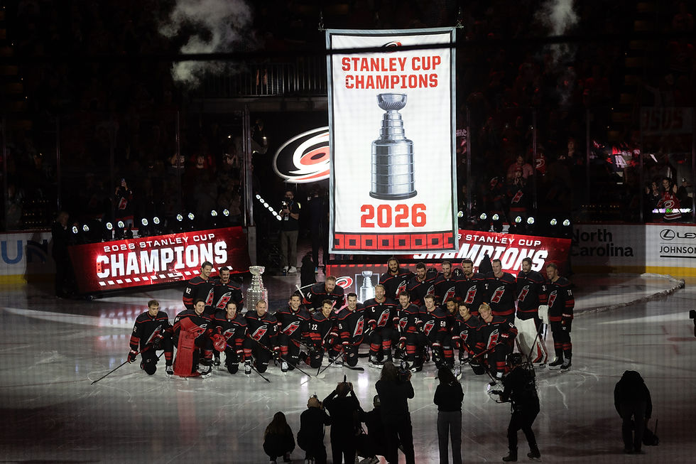 Panthers Hurricanes Hockey
Carolina Hurricanes pose for a group photo as the championship banner is raised during the team's Stanley Cup celebration before their season-opening NHL hockey game against the Florida Panthers in Raleigh, N.C., Tuesday, Sept. 29, 2026. (AP Photo/Karl DeBlaker)