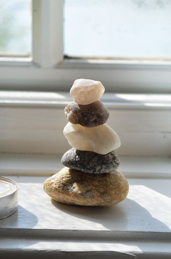 stacked pebbles on window sil