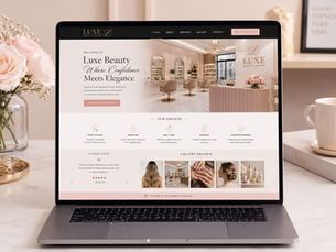 Luxury salon website homepage displayed on a laptop beside pink flowersLuxury salon website homepage displayed on a laptop beside pink flowers
