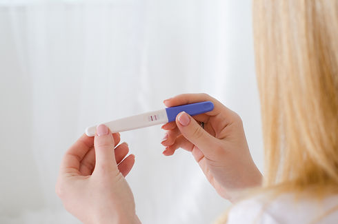 Pregnancy Test Woman Looking at Test.jpe