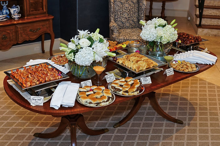 Appetizers and food displayed on a wooden table