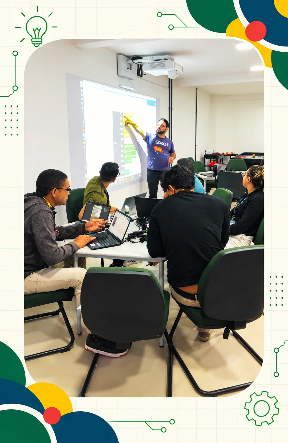 Professores em formação acompanham uma atividade de programação projetada na lousa digital