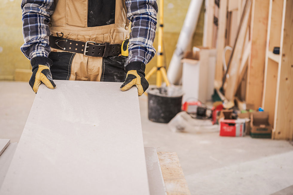 male-contractor-holding-piece-of-drywall-material-2026-01-09-08-26-30-utc.jpg