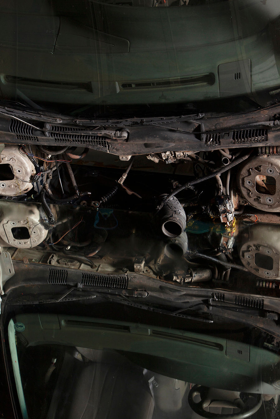 .Carcissus is an installation of a Ford Taurus erected perpendicular to the ground, staring into its own relfection in mirrors and a puddle of oil on the ground. It was made in collaboration with Eric Froh and installed at The Auto Show, a group exhibition of auto themed art held in a former auto shop in Detroit.