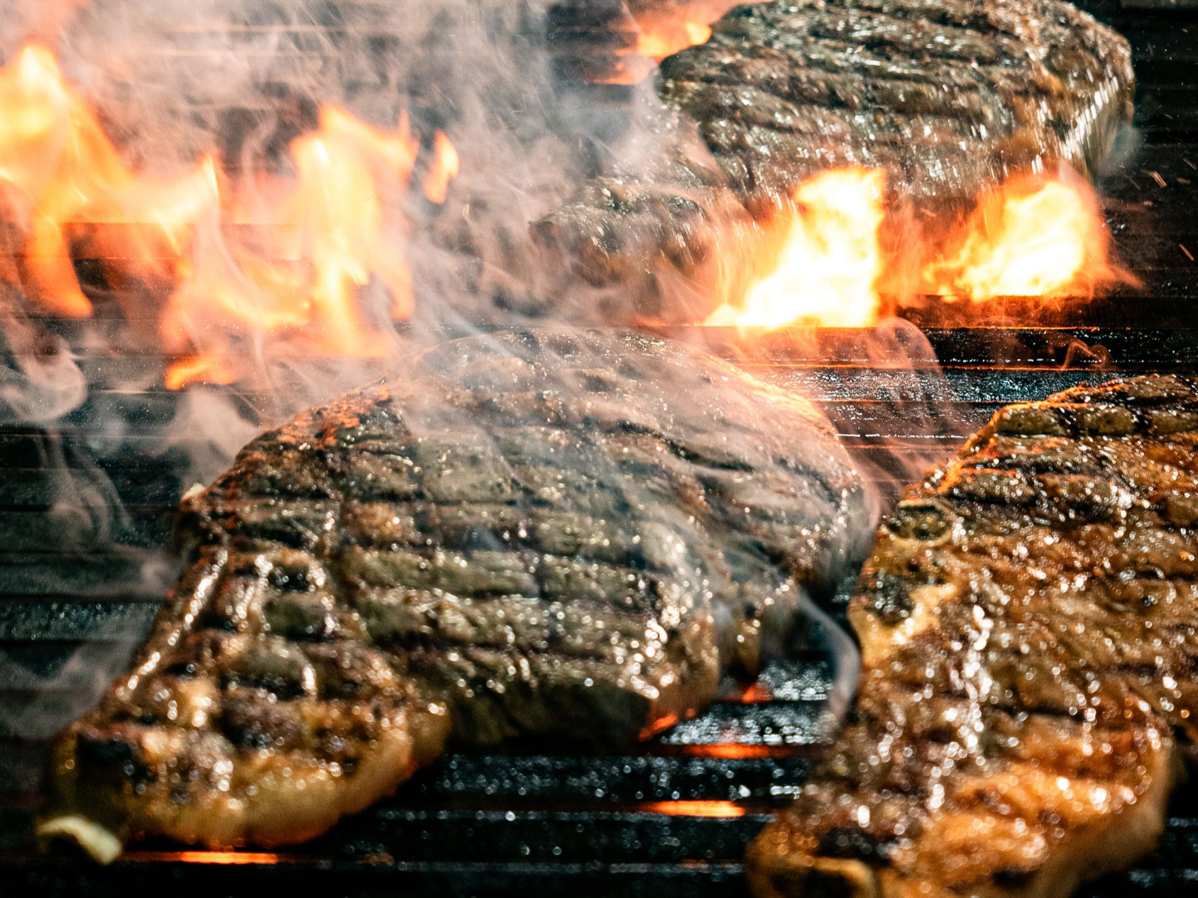 BBQ food cooking over an open grill