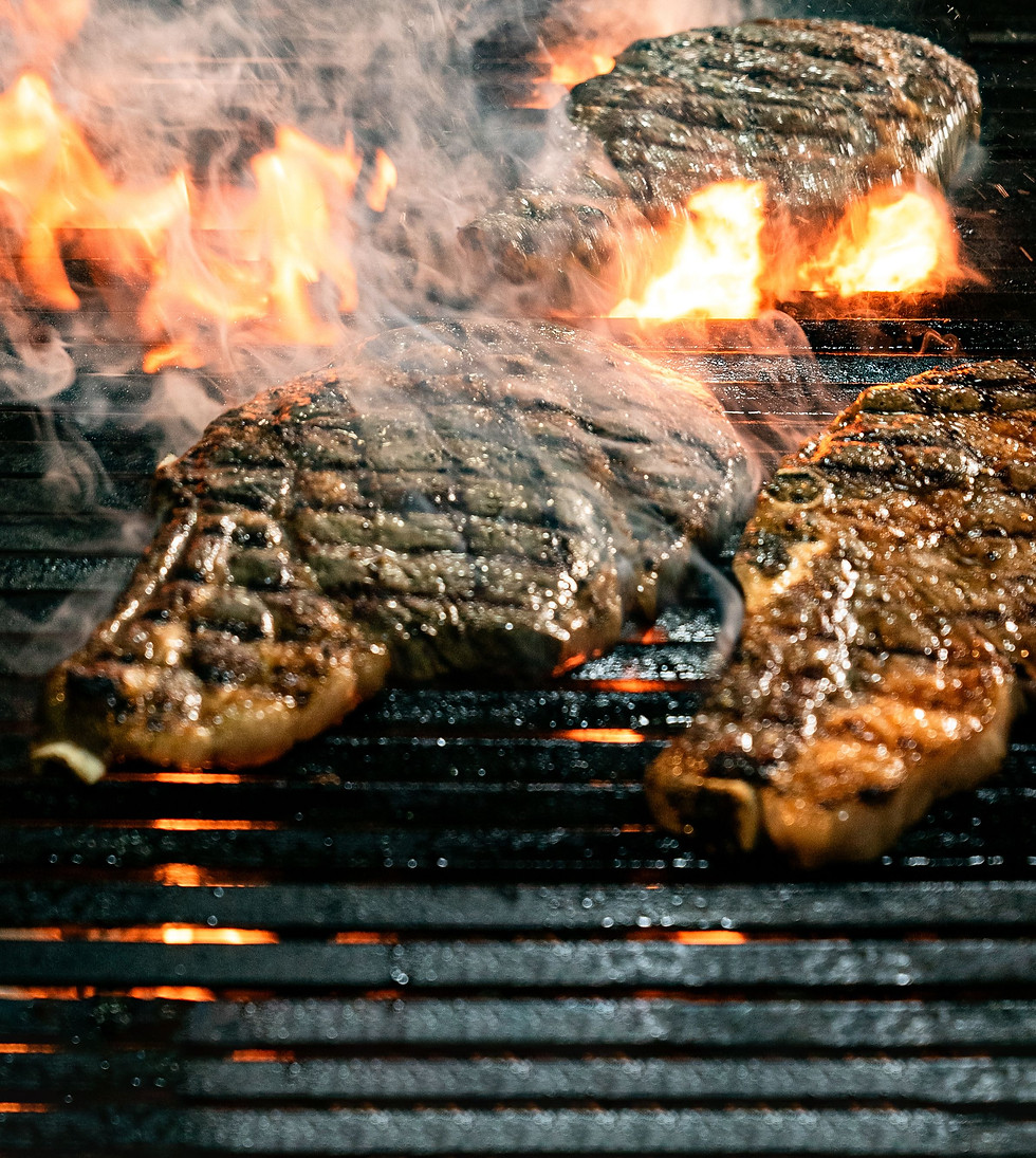 BBQ food cooking over an open grill