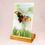 Thumbnail: The semi-transparent green abstract background behind the butterfly creates an airy, light feel.