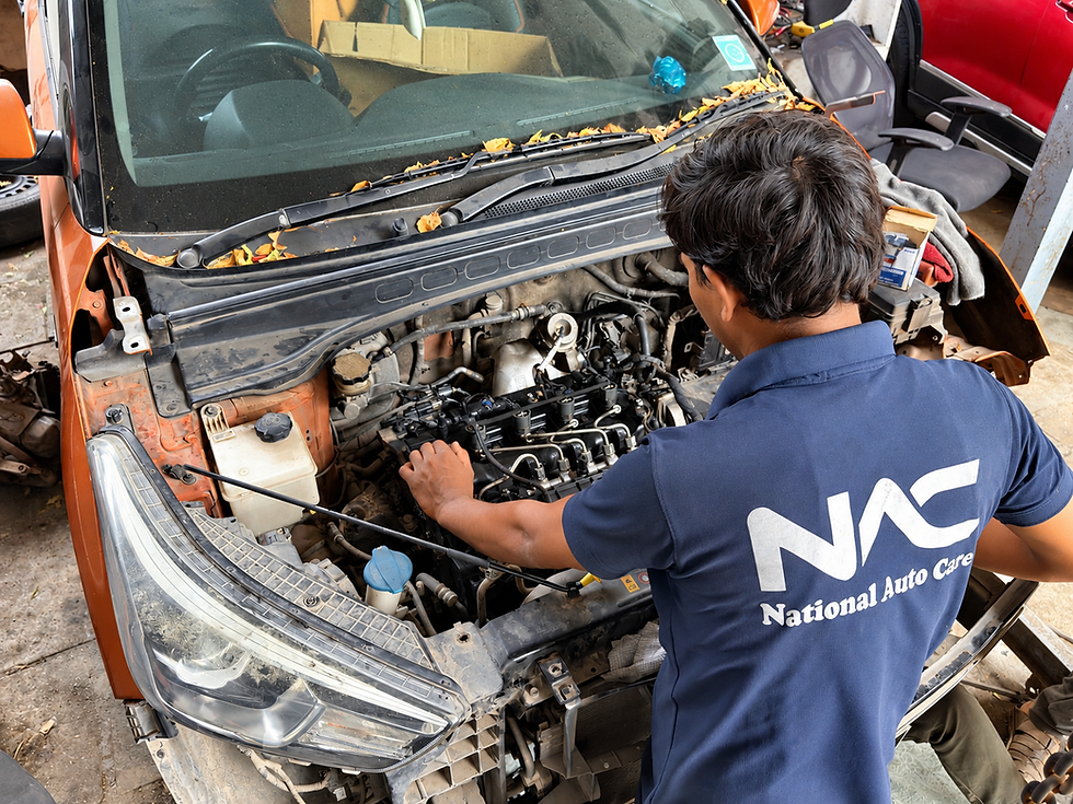 National Auto Care mechanic inspecting an engine during car mechanical repairs in Baner, Pune.