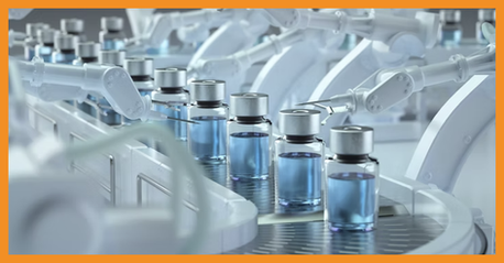 Automated pharmaceutical filling line with glass vials, representing pharmaceutical water quality monitoring.