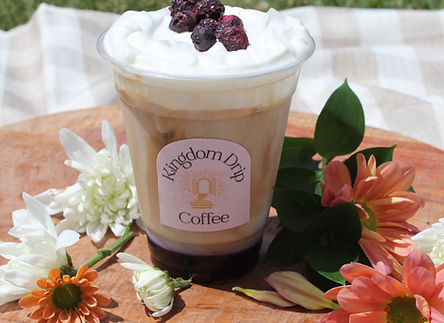 Blueberry basil latte with cold foam in branded cup with compnay logo
